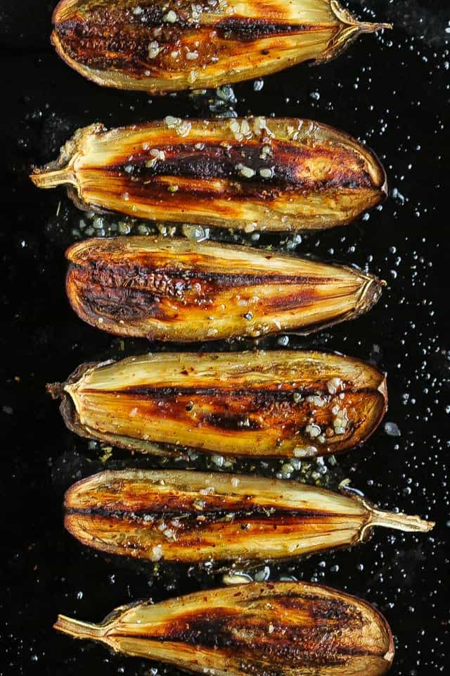 smoky roasted eggplant on black pan