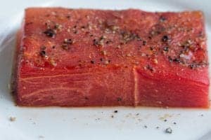 roasted watermelon steak on a plate.