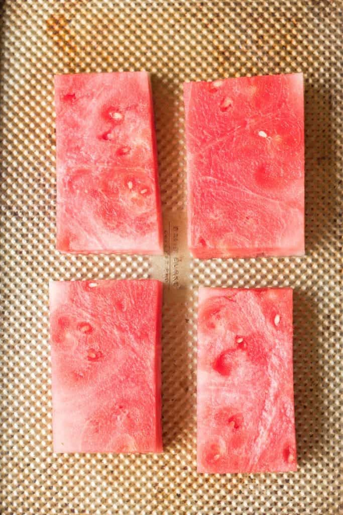 roasted watermelon steak on a plate.