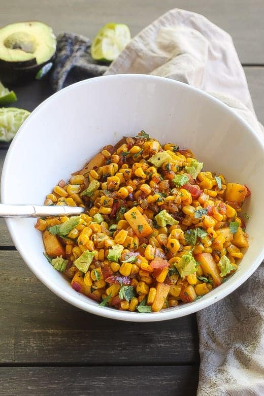 southwestern skilet corn saute in a white bowl