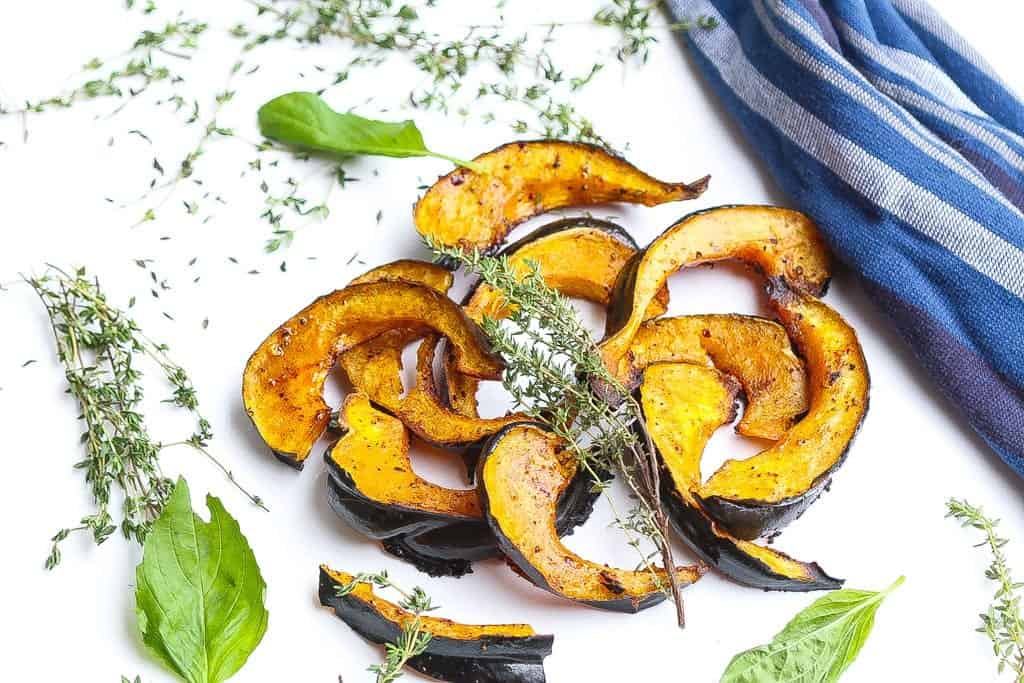 roasted acorn squash slices glazed with chili and honey topped with thyme