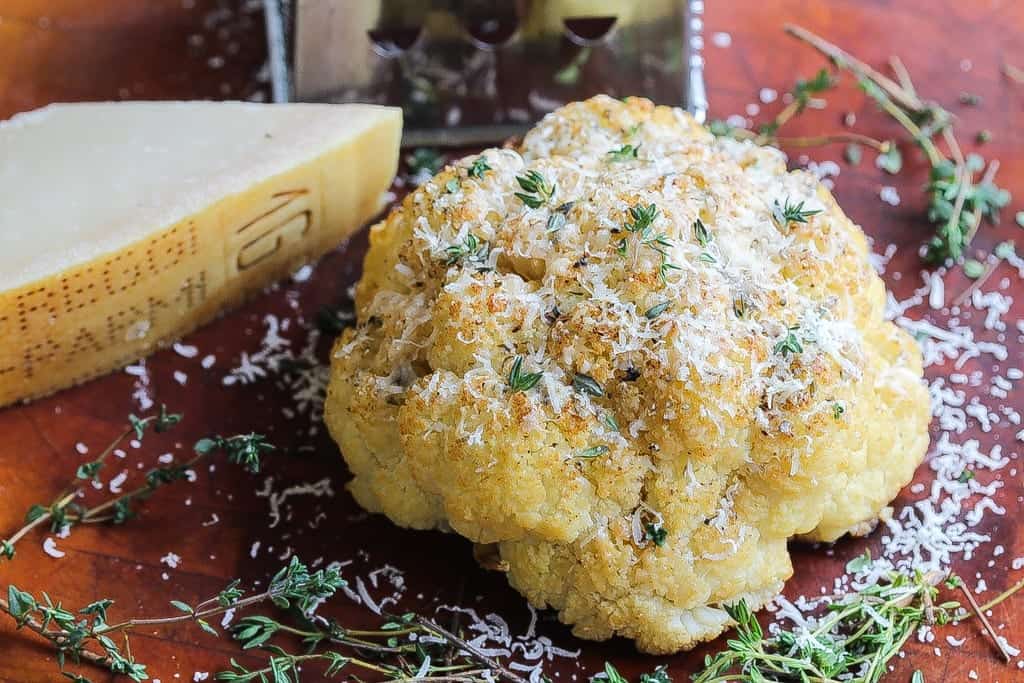 whole roasted cauliflower topped with parmigiano reggiano cheese.