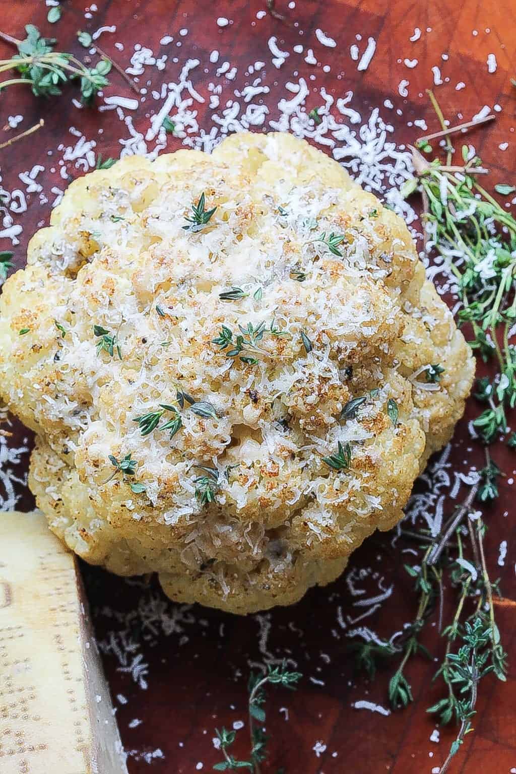 whole roasted cauliflower topped with parmigiano reggiano cheese.