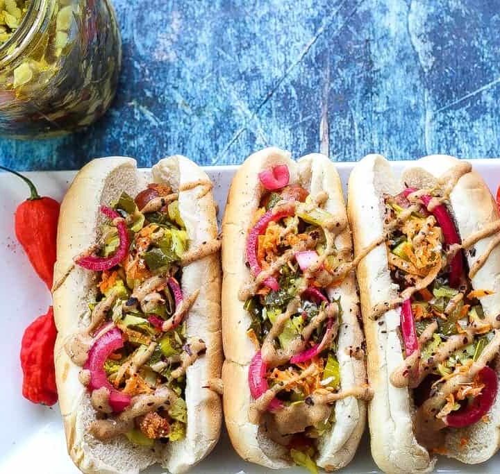 andouille sausage dog topped with mustard, pickled red onions, and chow chow