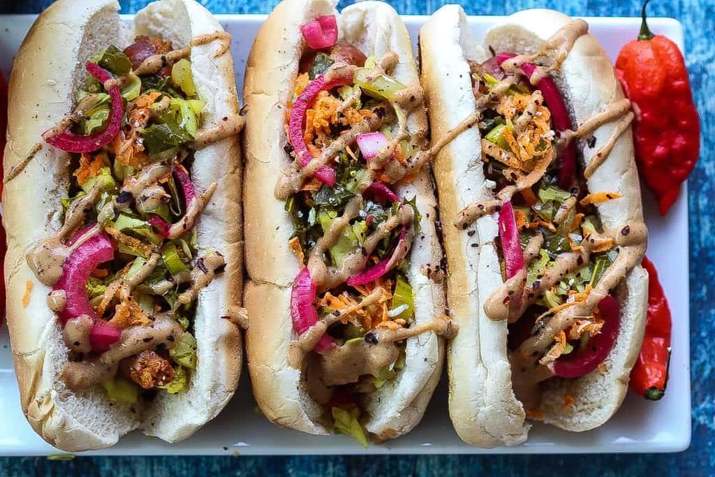 andouille sausage dog topped with mustard, pickled red onions, and chow chow