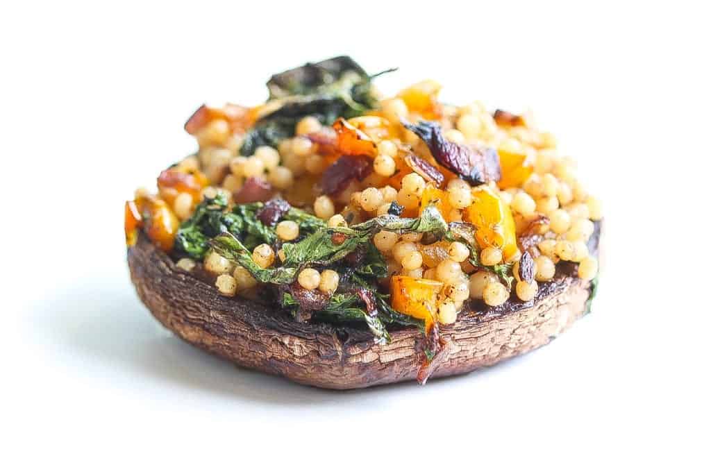 vegan smoked and stuffed portobello mushrooms with kale and couscous