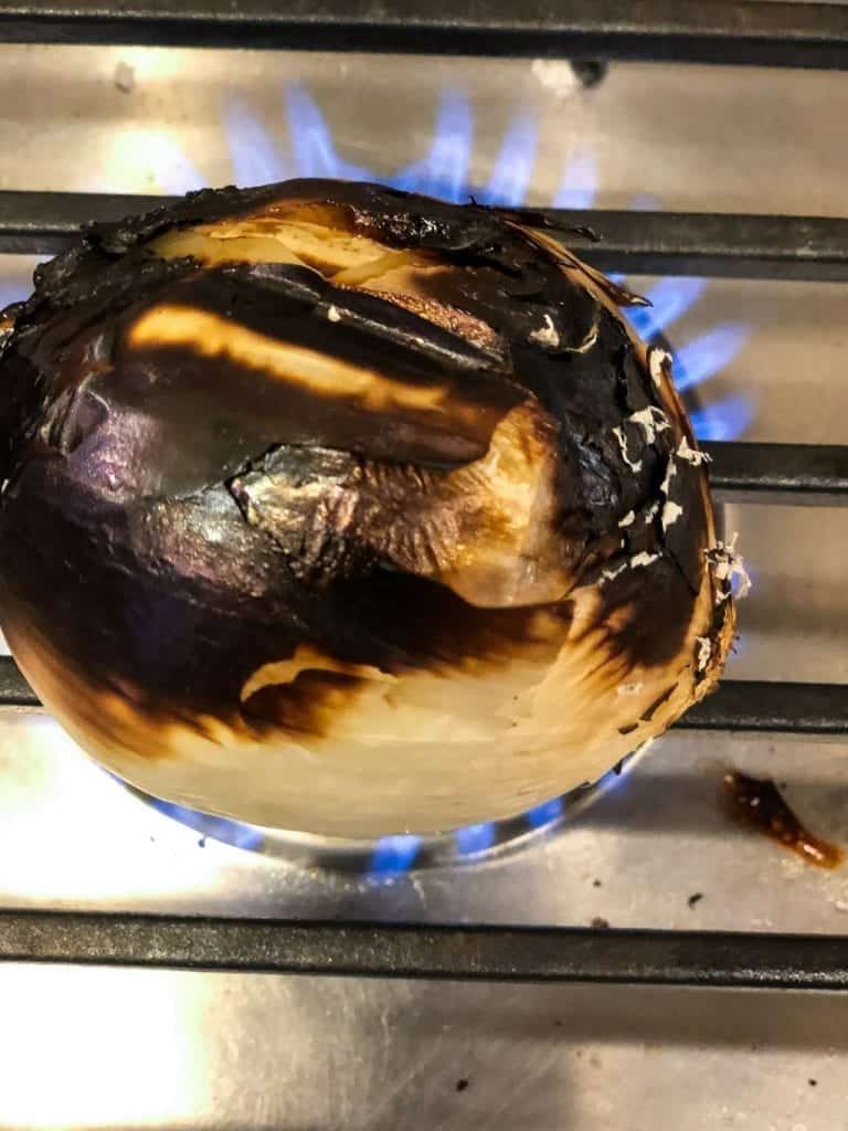 charred onion on cooktop