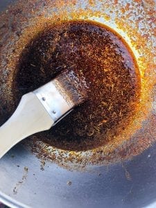 hot chili oil in a bowl with paint brush