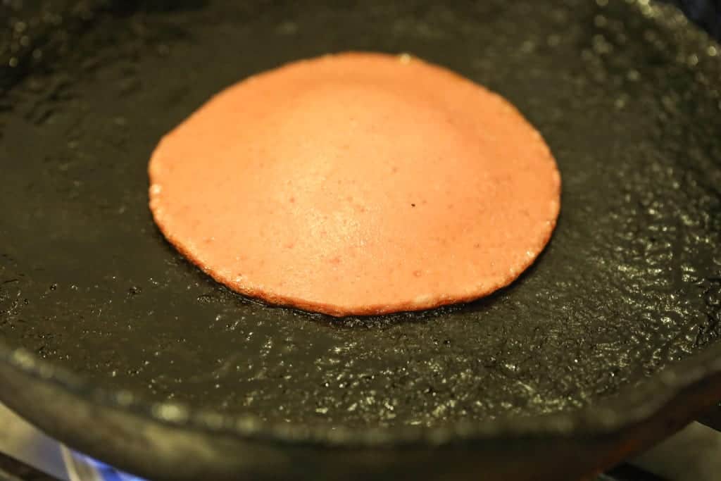 bologna frying in cast iron skillet