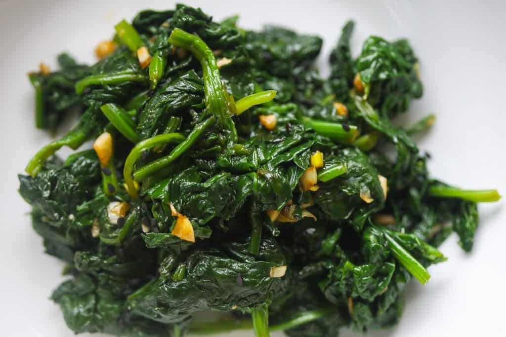 blanched spinach side dish in a bowl