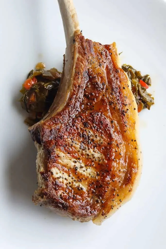 brined pork chops on a white plate