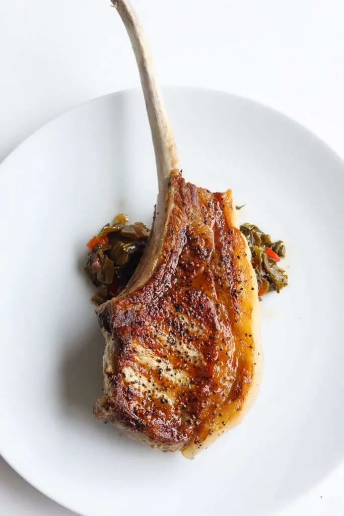 brined pork chops on a white plate