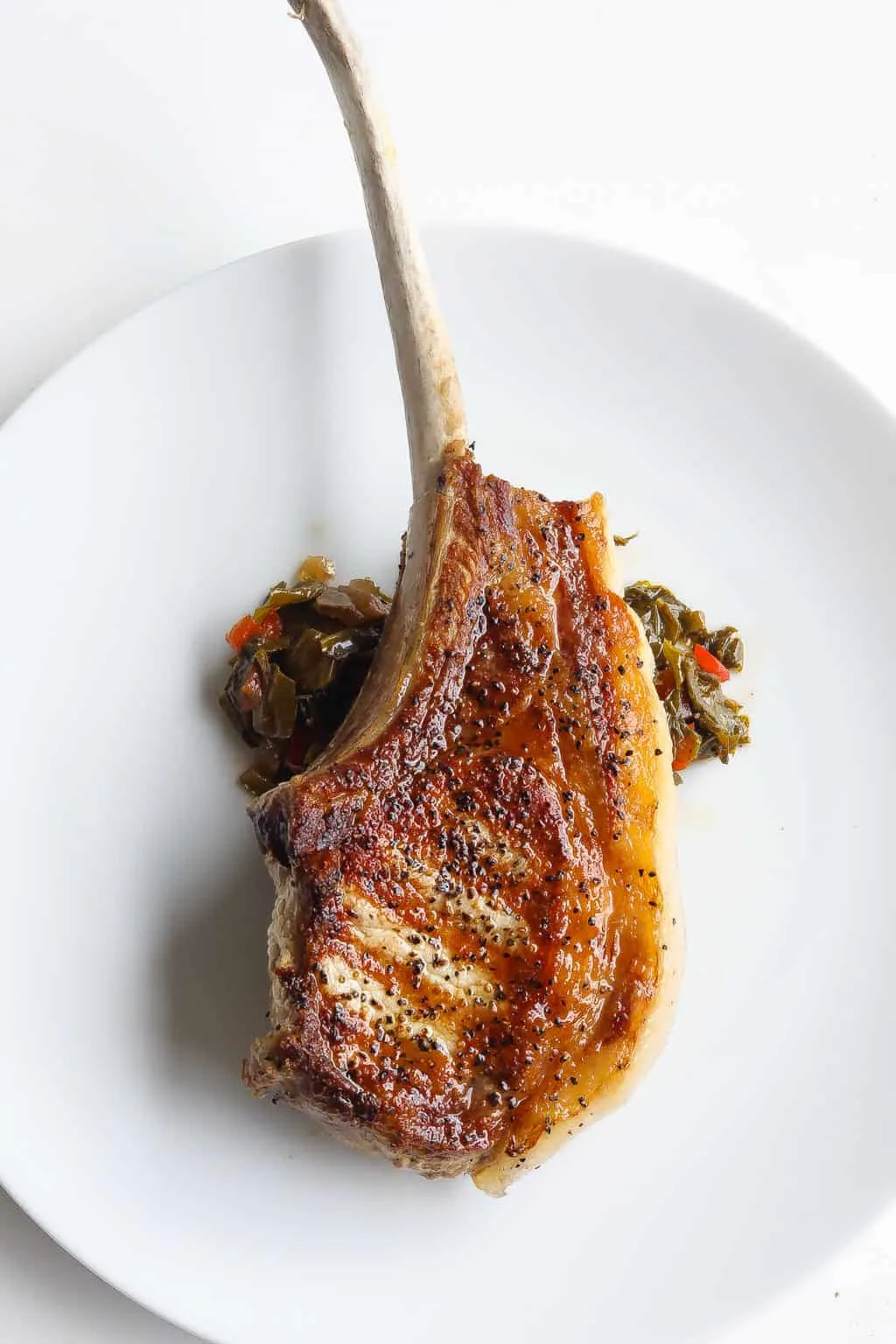 brined pork chops on a white plate