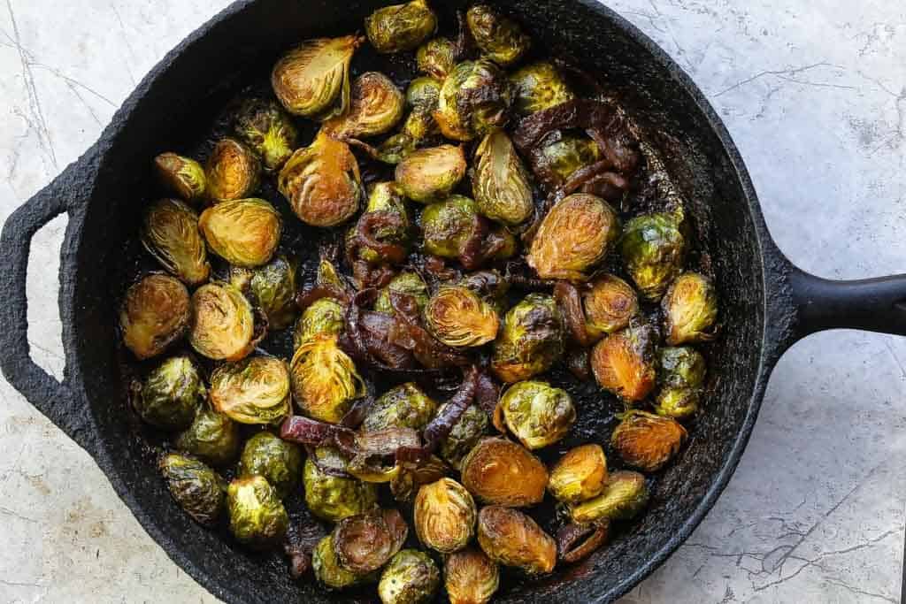 braised brussel sprouts in a skillet