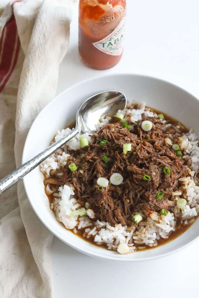 cajun rice and gravy with shredded beef in a bowl