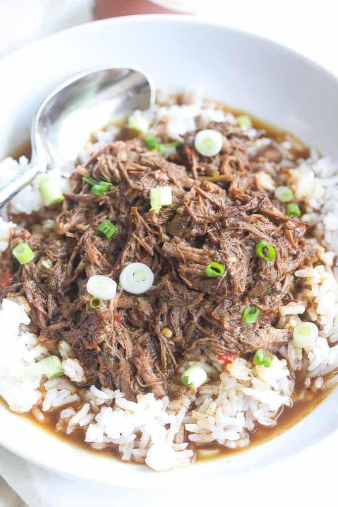 cajun rice and gravy with shredded beef in a bowl