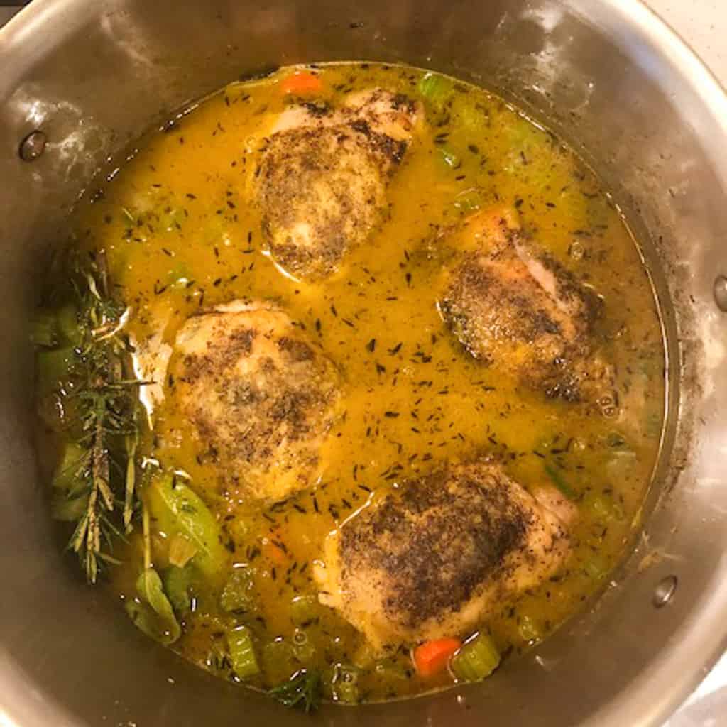 chicken soup cooking in pot
