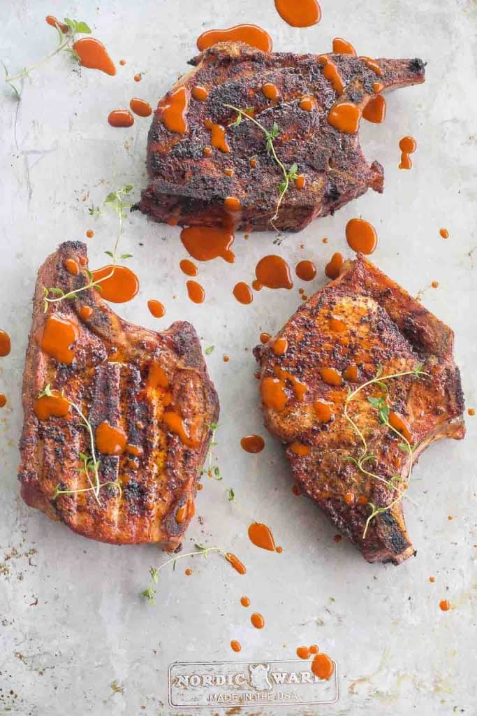 3 smoked pork chops on a platter