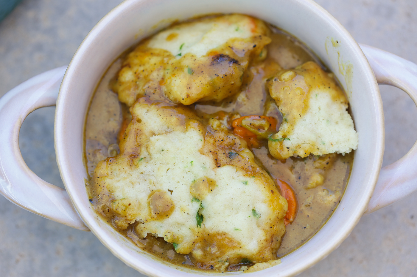 Southern chicken and dumplings in a white bowl