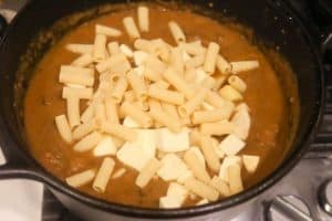 rigatoni and potatoes boiling in soup