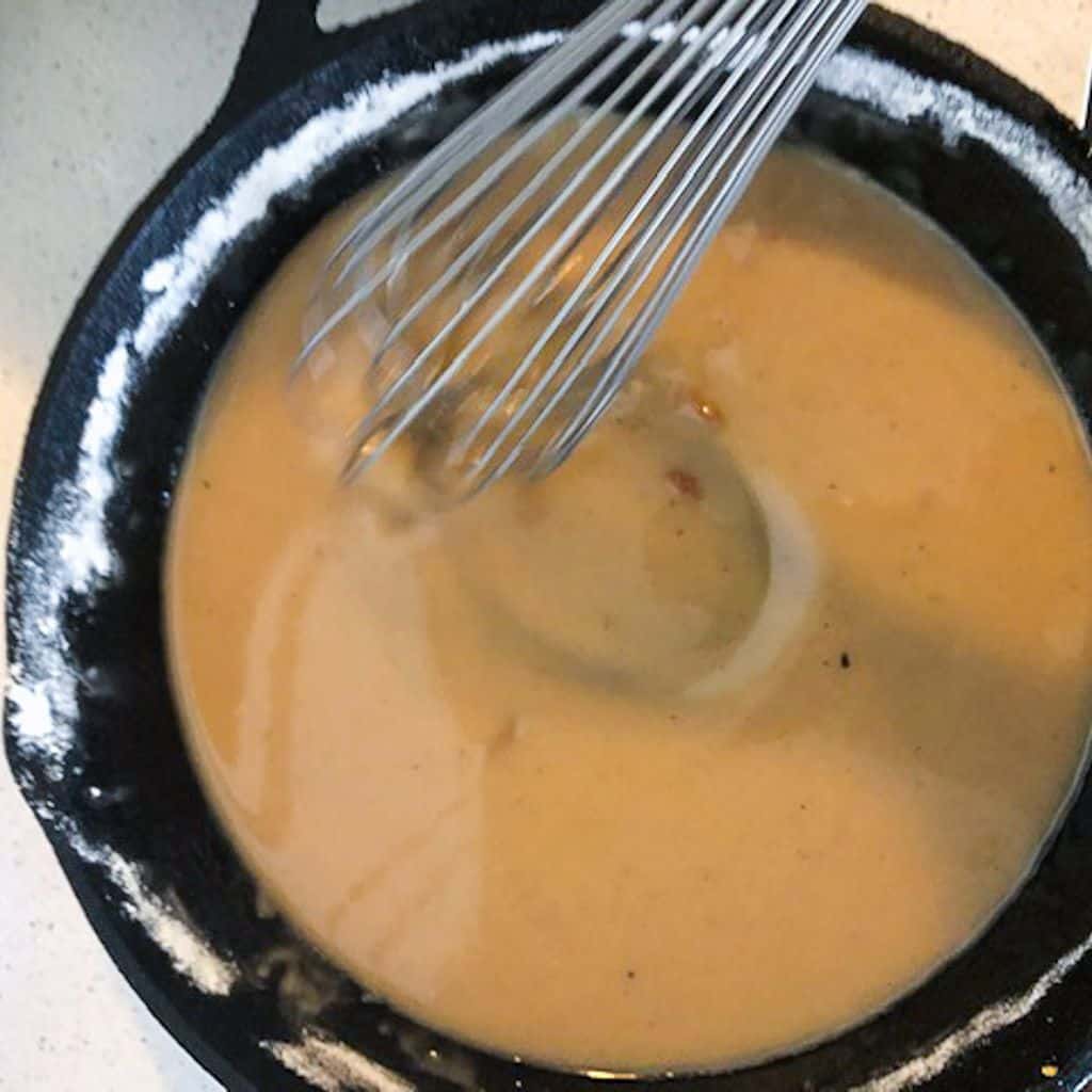 mixing roux in a skillet