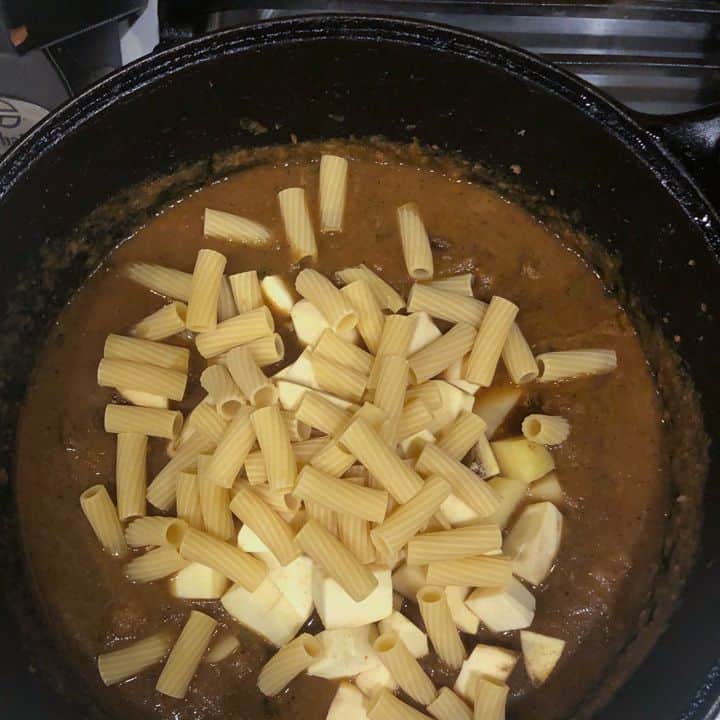 pasta and potatoes boiling in soup