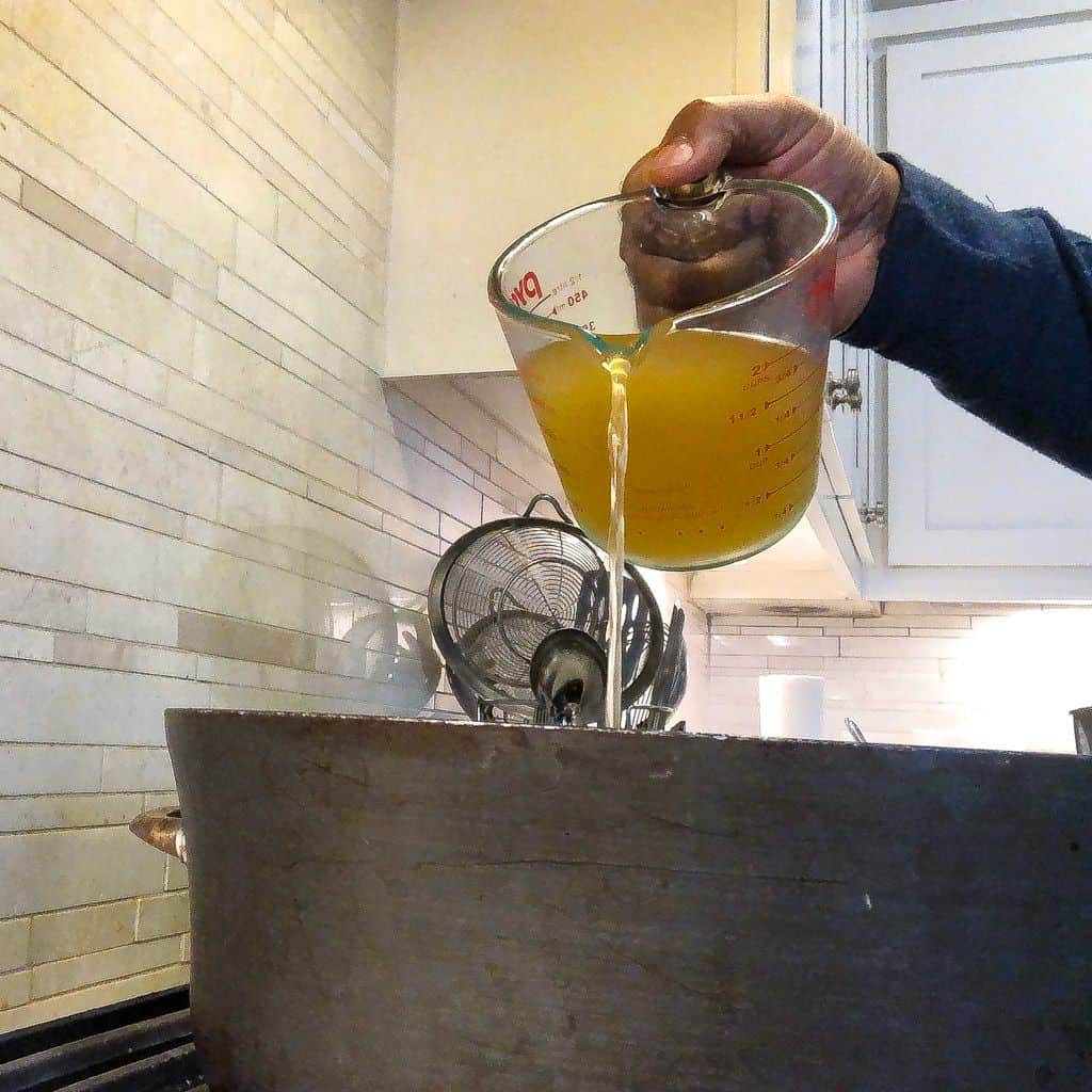 pouring stock in pot