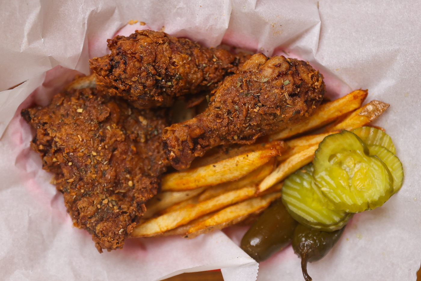 fried chicken pieces on a baking sheet