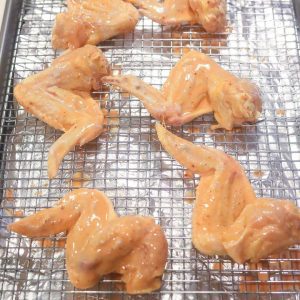 raw chicken resting on a tray