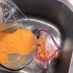 pouring marinade into bag