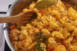 cauliflower cooking in curry sauce