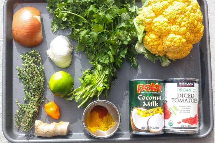 cauliflower curry recipe ingredients on a tray 