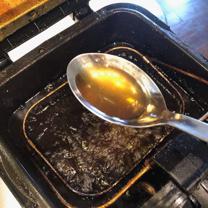frying oil in a large spoon