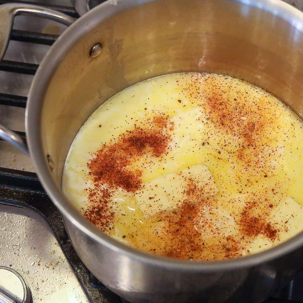 melted butter and milk with spices in a pot