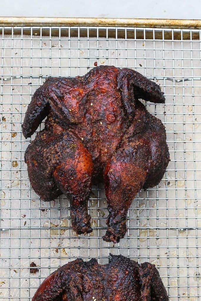 smoked cornish hen resting on a tray