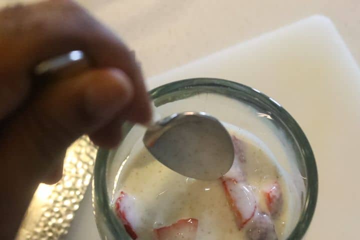 adding crema to strawberries