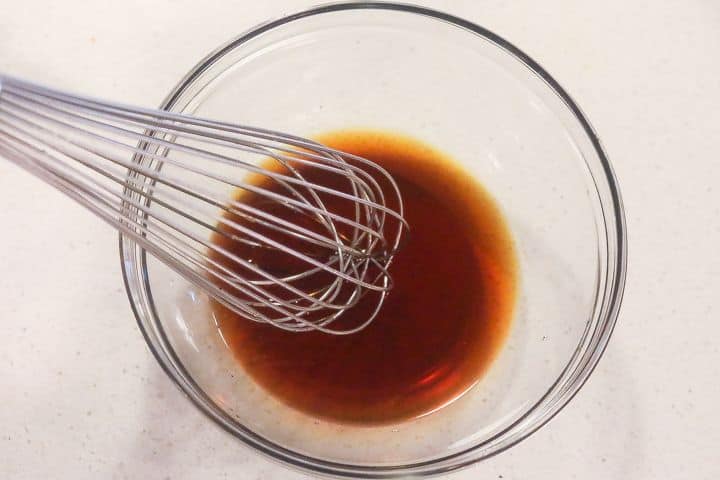 sunomono sauce whisked in a glass bowl