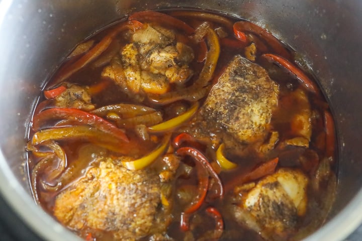 chicken cooking in sauce