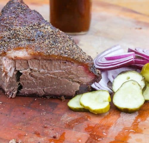 smoked brisket on a cutting board