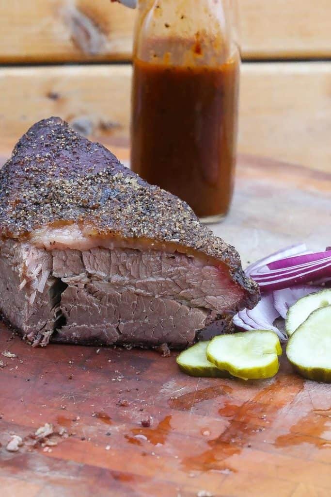 smoked brisket on a cutting board