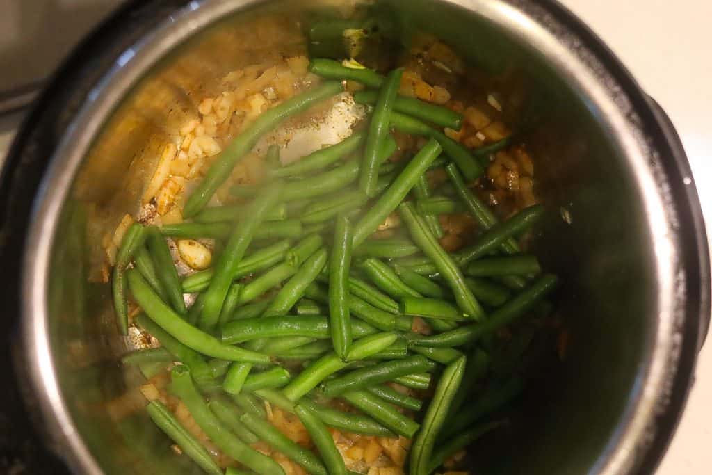 green beans cooking in pan