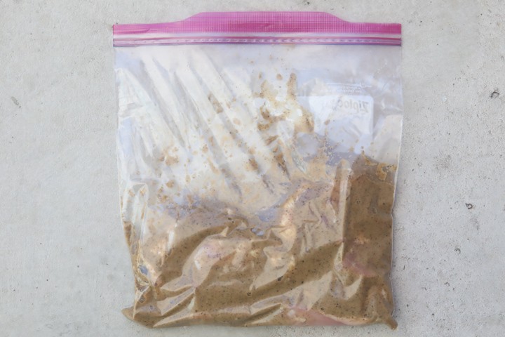 chicken marinating in ziplock bag