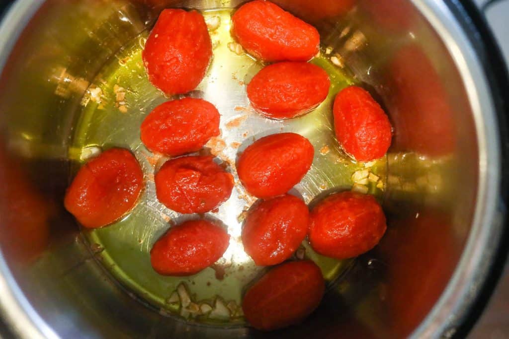 tomatoes frying in pan