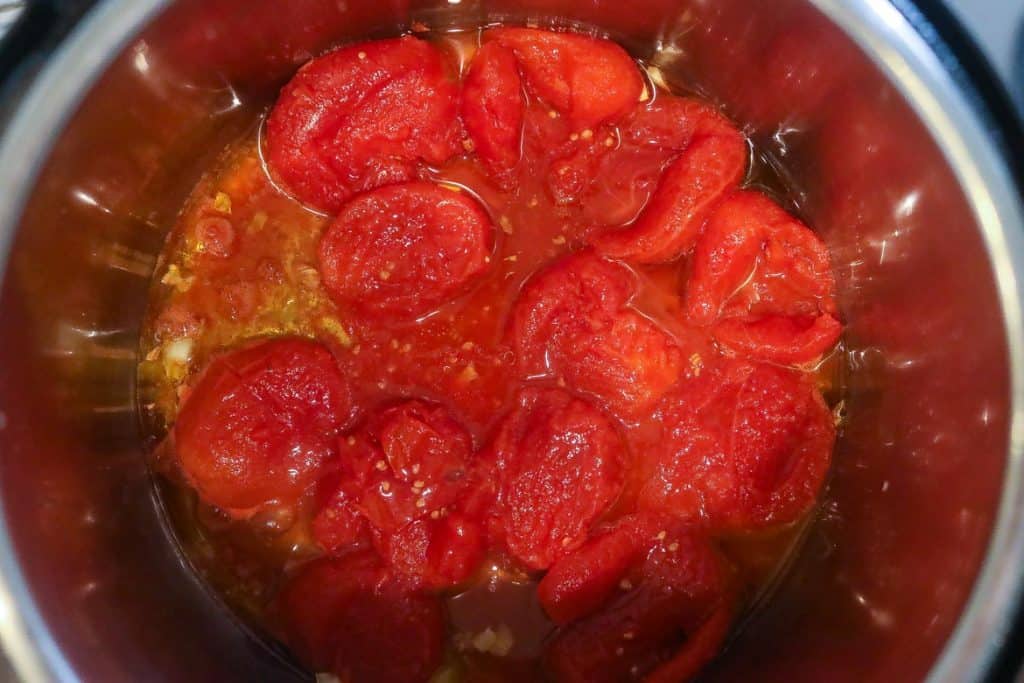 crushed tomatoes cooking in pot