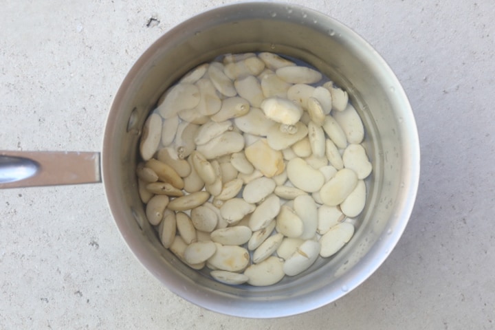 lima beans in pot of water