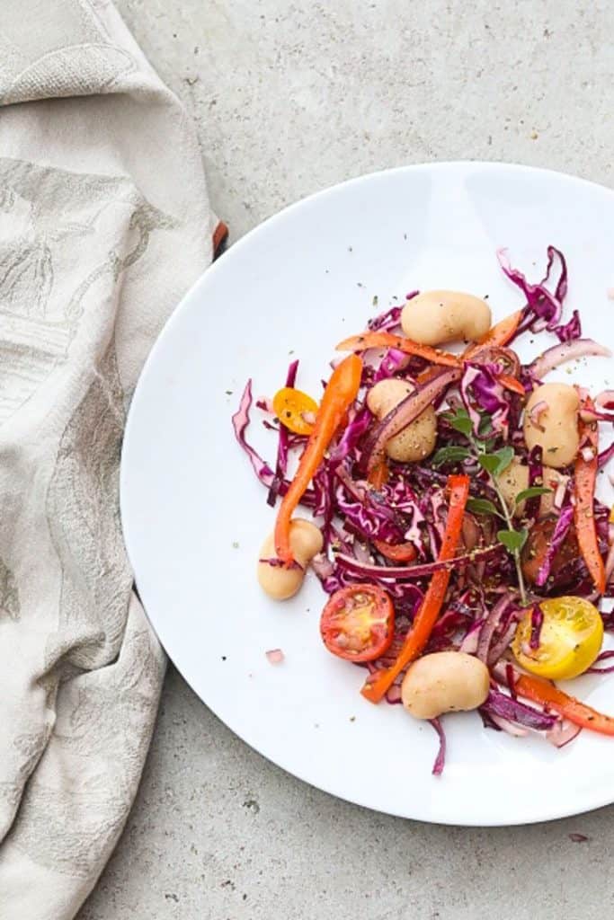 lima bean salad on a white plate