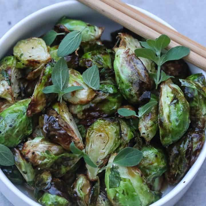 fried brussel sprouts in a bowl with chopsticks