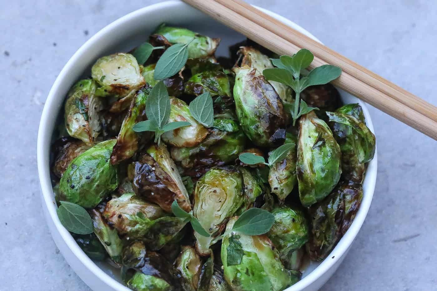fried brussel sprouts in a bowl with chopsticks