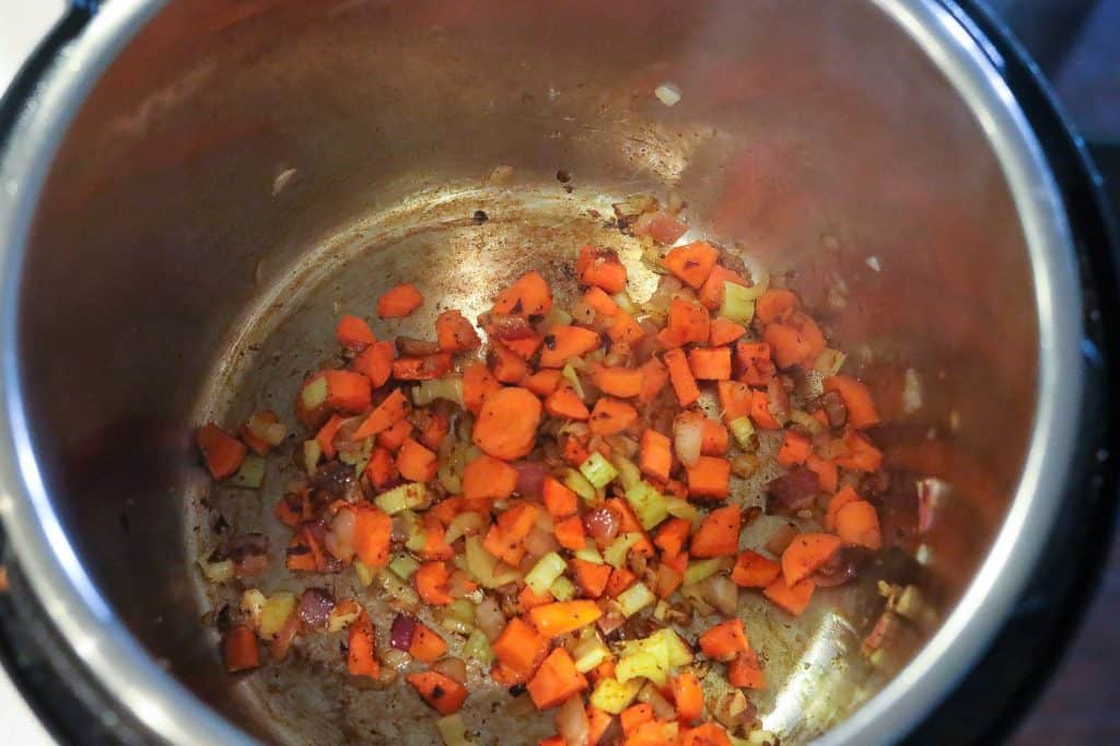 vegetables sauteing in pan