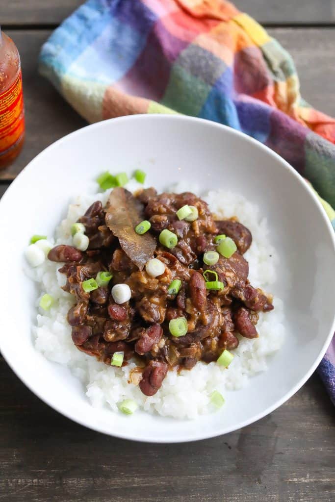 red beans and rice with sausage in a white bowl